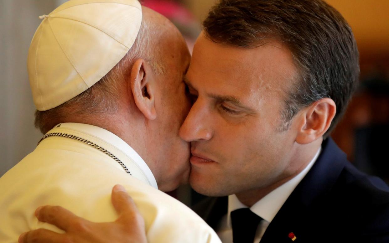 Pope Francis and French President Emmanuel Macron held a long private meeting at the Vatican - REUTERS