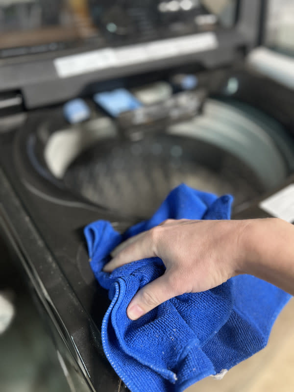 Clean the dispensers of your washing machine to remove residue.<p>Emily Fazio</p>