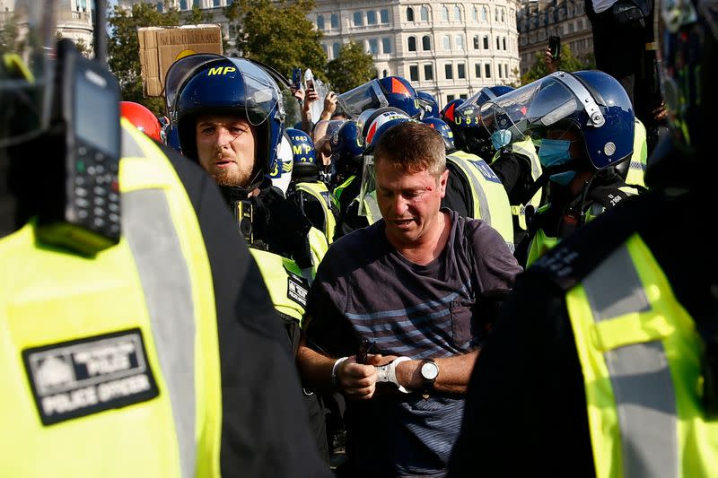 People gather in Trafalgar Square to protest against the lockdown imposed by the government, in London