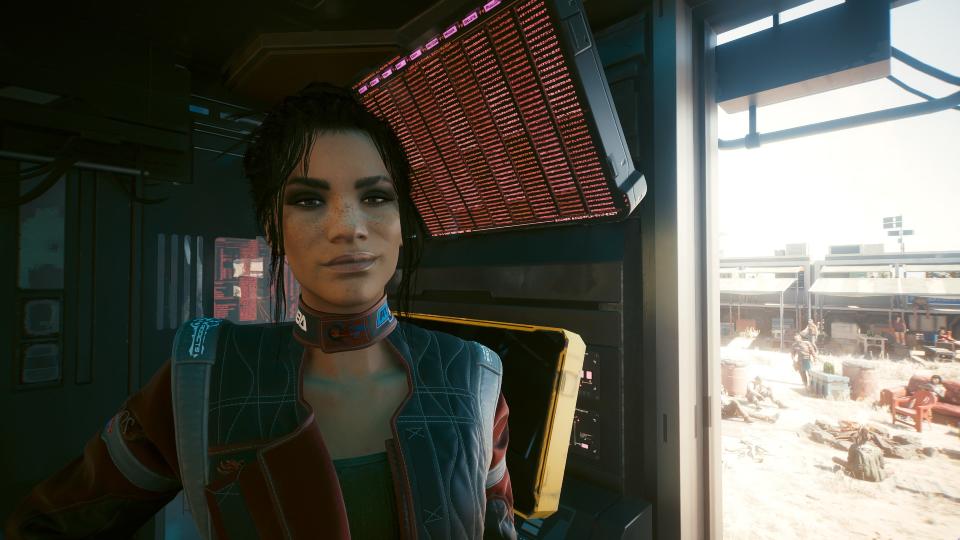 Panam Palmer, a romance option from Cyberpunk 2077, smirks haplessly at the camera.