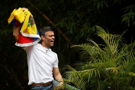 FILE PHOTO: Venezuela's opposition leader Leopoldo Lopez, who has been granted house arrest after more than three years in jail, salutes supporters, in Caracas, Venezuela July 8, 2017. REUTERS/Andres Martinez Casares