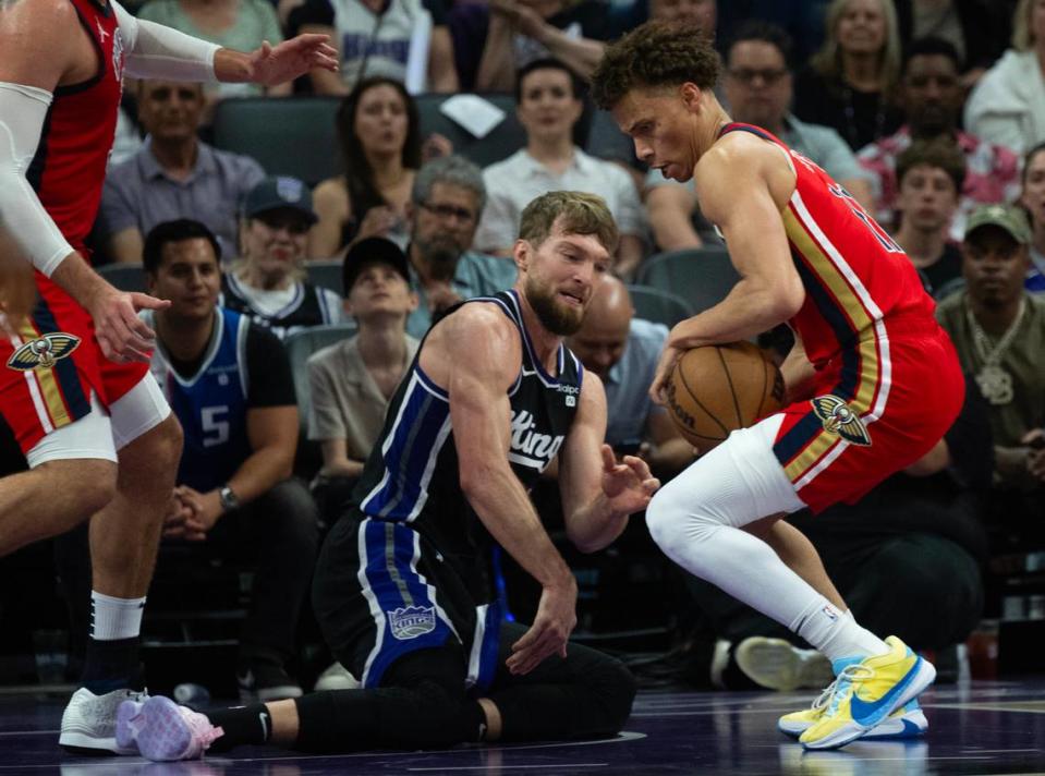 New Orleans Pelicans guard Dyson Daniels (11) steals the ball from Sacramento Kings center Domantas Sabonis (10) during a game Thursday at Golden 1 Center in Sacramento.