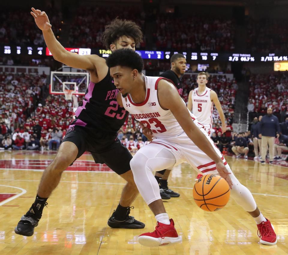 Wisconsin guard Chucky Hepburn (23) makes a move along the baseline on Penn State guard Dallion Johnson (23) during the Badgers' 51-49 victory Feb. 5, 2022, in Madison.