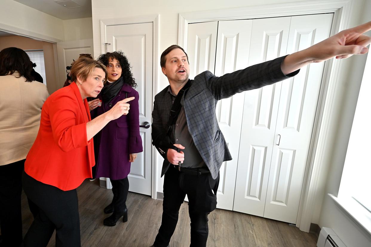 Gov. Maura Healey tours a bedroom at Grand Street Commons with state Rep. David LeBoeuf and Worcester City Councilor Sarai Rivera on Monday.