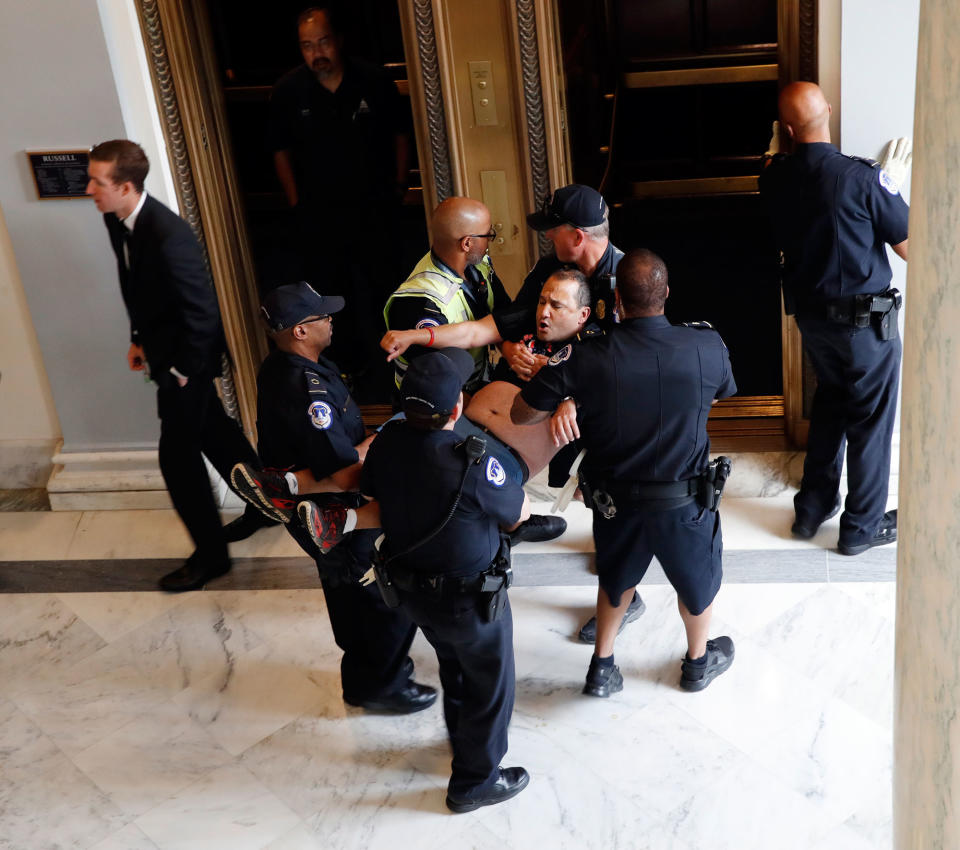 A man is removed from a sit-in