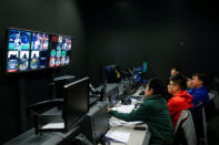 Directors and technicians monitor the broadcast of a livestream commentary of a NFL American football game in the control room of a studio of the media and gaming firm Tencent Holdings in Beijing, China, October 16, 2017. REUTERS/Thomas Peter