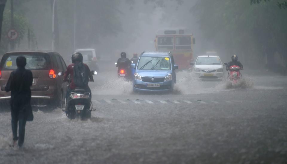 Mumbai: Vehicles negotiate a flooded road in Colaba amid a heavy rainfall triggered by Cyclone Tauktae on Monday.