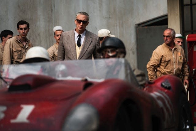 Enzo Ferrari (Adam Driver, center) enters his racing team in a treacherous Italian race in an effort to save his auto empire in Michael Mann's "Ferrari."