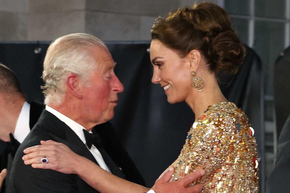 <p>Chris Jackson/Getty</p> King Charles and Kate Middleton embrace at Royal Albert Hall in London on September 28, 2021.