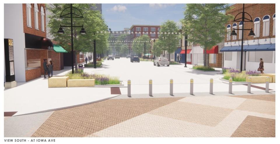 A rendering of what downtown Dubuque St. will look like after construction is completed in September. The road will open to car traffic in August, but beautifying efforts will continue into the fall.