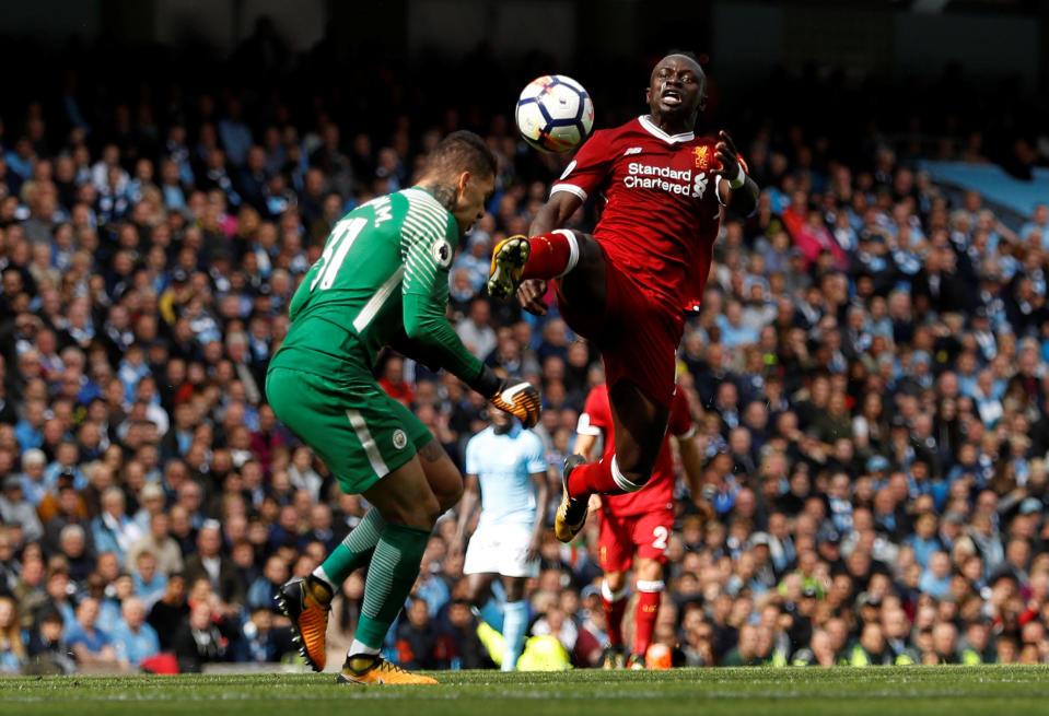 <p>Manchester City’s Ederson Moraes is fouled by Liverpool’s Sadio Mane resulting in a red card for Mane </p>