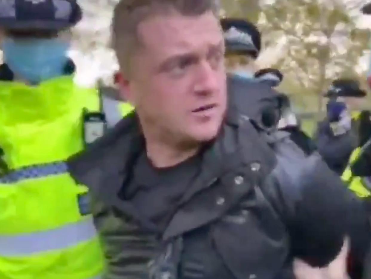 Tommy Robinson is led away by police after attending London’s Hyde Park (Twitter)