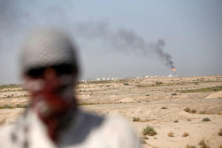 Excess gas is burnt off at the west Qurna 2 oilfield, during a protest in north Basra, Iraq July 14, 2018. Picture taken July 14, 2018. REUTERS/Essam al-Sudani