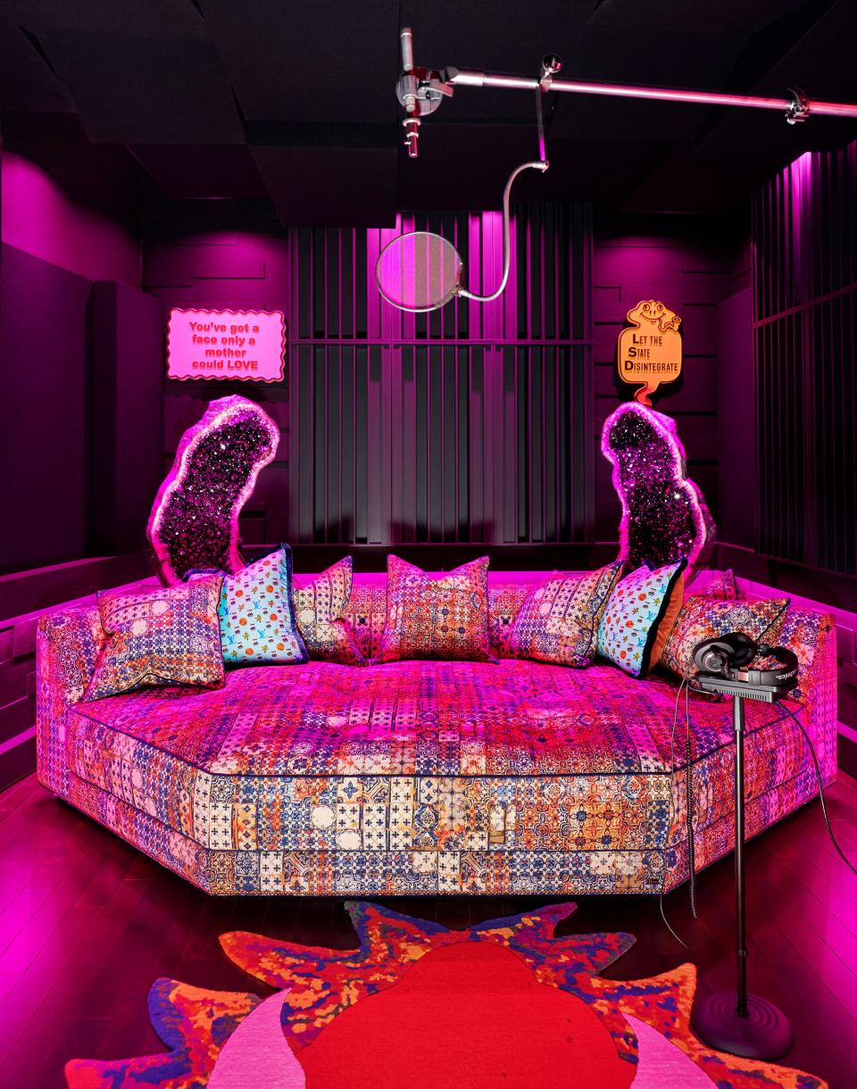 A Ferris Rafauli custom daybed wears a Jean Paul Gaultier textile in the recording studio. The accent pillows, also by Rafauli, are made of Jonas Wood x Louis Vuitton Monogram silk scarves.