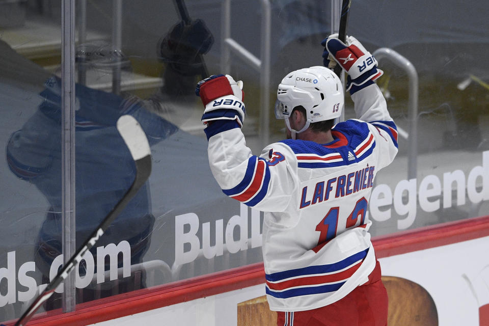 New York Rangers left wing Alexis Lafrenière (13) celebrates his goal during the second period of an NHL hockey game against the Washington Capitals, Saturday, Feb. 20, 2021, in Washington. (AP Photo/Nick Wass)