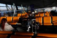 Travellers wait at Beijing Capital International Airport