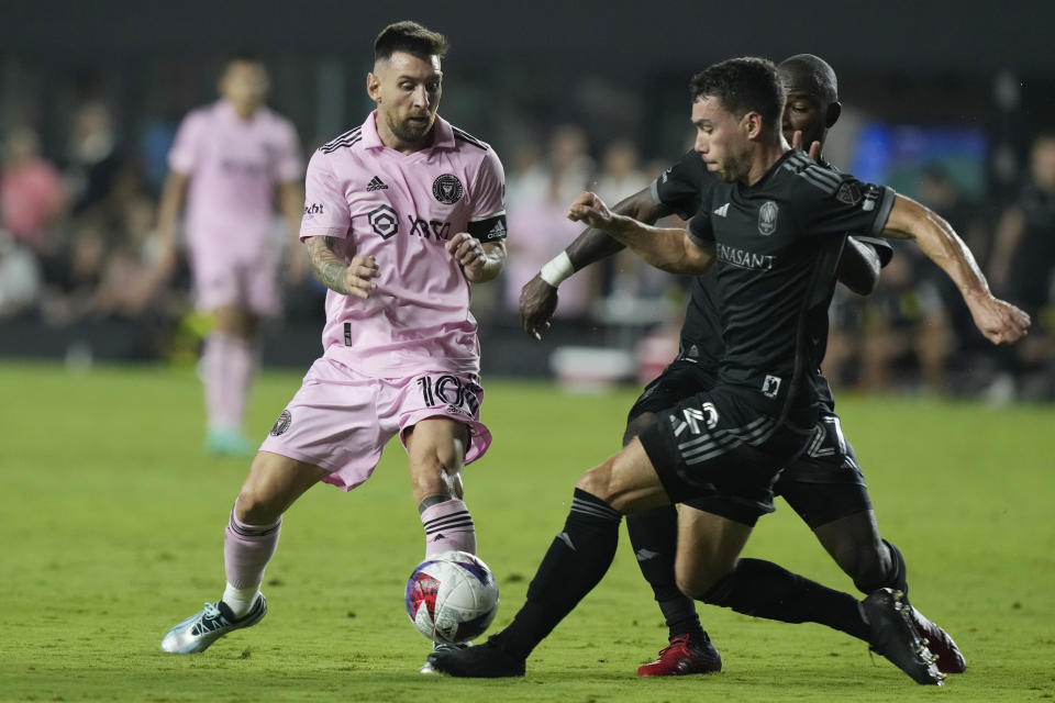 Nashville SC defender Daniel Lovitz (2) stops a pass by Inter Miami forward Lionel Messi during the second half of an MLS soccer match, Wednesday, Aug. 30, 2023, in Fort Lauderdale, Fla. (AP Photo/Marta Lavandier)