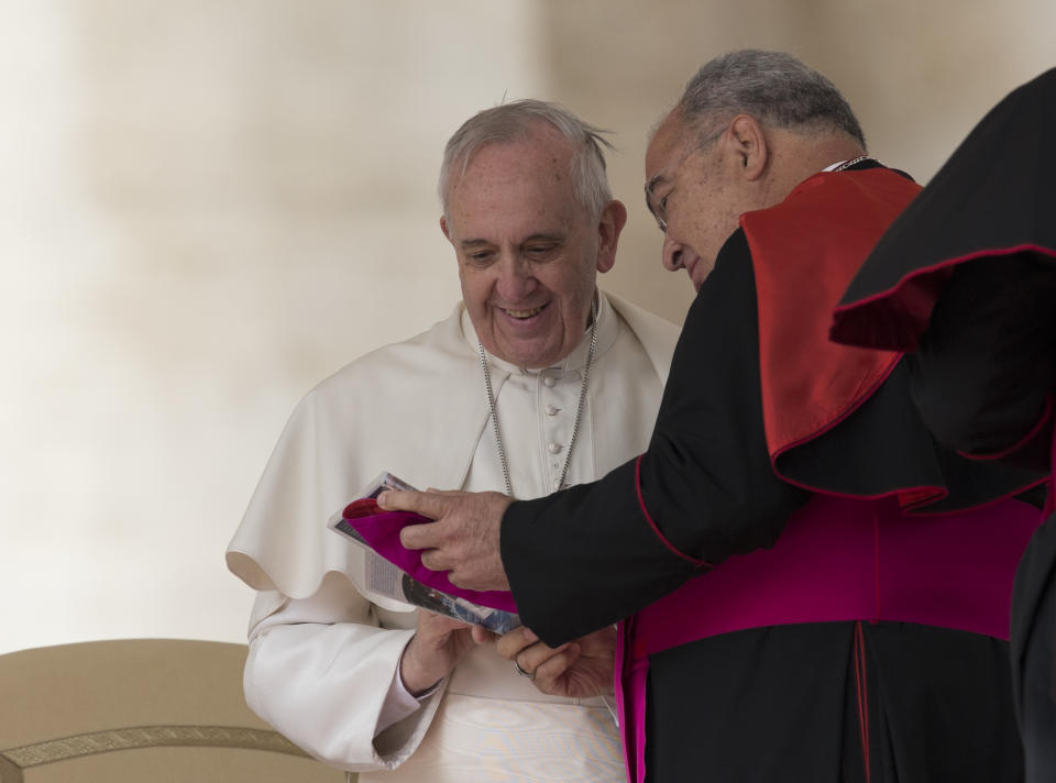 Pope Francis is greeted by Brazilian archbishop Joao Tempesta , who will be elevated cardinal next Saturday, Feb 22, in a consistory, in St. Peter's Square at the Vatican, after his general audience, Wednesday, Feb. 19, 2014. (AP Photo/Alessandra Tarantino)