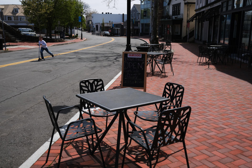 WESTPORT, CONNECTICUT - MAY 05: A cafe along a shopping street in the affluent community remains mostly empty of pedestrians and open stores on May 05, 2020 in Westport, Connecticut. A growing number of states have begun reopening parts of the economy amid demonstrations like the one yesterday that targeted the Connecticut state capital and the governor's mansion in Hartford. (Photo by Spencer Platt/Getty Images)