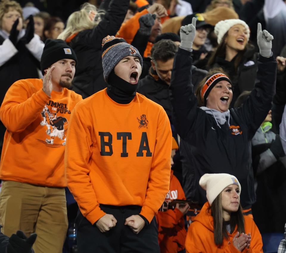 Massillon fans cheer on the Tigers as they defeated Akron Hoban on Thursday night for the Division II state championship at Tom Benson Hall of Fame Stadium in Canton.