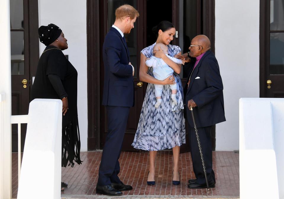 Prince Harry and Meghan Markle took their almost 5-month-old son, Archie, <a href="https://people.com/royals/prince-harry-and-meghan-markle-take-archie-to-meet-archbishop-desmond-tutu-in-south-africa/" rel="nofollow noopener" target="_blank" data-ylk="slk:on his first royal outing;elm:context_link;itc:0;sec:content-canvas" class="link ">on his first royal outing</a> to meet with Archbishop Desmond Tutu and his daughter at their legacy foundation in Cape Town. Meghan looked ultra-chic in a blue printed <a href="https://click.linksynergy.com/deeplink?id=93xLBvPhAeE&mid=37811&murl=https%3A%2F%2Fwww.clubmonaco.com%2F&u1=PEO%2CShopping%3AEveryOutfitMeghanMarkleHasWornonHerRoyalTourinAfrica%28andHowtoGetHerLook%21%29%2Ckamiphillips2%2CUnc%2CGal%2C7319077%2C201910%2CI" rel="nofollow noopener" target="_blank" data-ylk="slk:Club Monaco;elm:context_link;itc:0;sec:content-canvas" class="link ">Club Monaco</a> silk dress with a tie waist and pumps. <strong>Get the Look!</strong> Reformation Fauna Front Button Midi Dress, $218; <a href="https://click.linksynergy.com/deeplink?id=93xLBvPhAeE&mid=1237&murl=https%3A%2F%2Fshop.nordstrom.com%2Fs%2Freformation-fauna-front-button-midi-dress%2F5102525&u1=PEO%2CShopping%3AEveryOutfitMeghanMarkleHasWornonHerRoyalTourinAfrica%28andHowtoGetHerLook%21%29%2Ckamiphillips2%2CUnc%2CGal%2C7319077%2C201910%2CI" rel="nofollow noopener" target="_blank" data-ylk="slk:nordstrom.com;elm:context_link;itc:0;sec:content-canvas" class="link ">nordstrom.com</a> PRETTYGARDEN Summer Striped Short Sleeve V Neck Button Down Belted Swing Midi Dress with Pockets, $24.99; <a href="https://www.amazon.com/PRETTYGARDEN-Womens-Summer-Striped-Pockets/dp/B07QKYKPW6/ref=as_li_ss_tl?dchild=1&keywords=blue+printed+shirtdress+women&qid=1569426285&sr=8-48&linkCode=ll1&tag=poamzfmeghanmarkleafricatourkphillips0919-20&linkId=a0f00789e74bd587d23e30e3050aeed4&language=en_US" rel="nofollow noopener" target="_blank" data-ylk="slk:amazon.com;elm:context_link;itc:0;sec:content-canvas" class="link ">amazon.com</a> Karen Kane Cotton Shirtdress, $48.93 (orig. $138); <a href="https://click.linksynergy.com/deeplink?id=93xLBvPhAeE&mid=3184&murl=https%3A%2F%2Fwww.macys.com%2Fshop%2Fproduct%2Fkaren-kane-cotton-shirtdress%3FID%3D8998499&u1=PEO%2CShopping%3AEveryOutfitMeghanMarkleHasWornonHerRoyalTourinAfrica%28andHowtoGetHerLook%21%29%2Ckamiphillips2%2CUnc%2CGal%2C7319077%2C201910%2CI" rel="nofollow noopener" target="_blank" data-ylk="slk:macys.com;elm:context_link;itc:0;sec:content-canvas" class="link ">macys.com</a> Anne Klein Printed A-Line Dress, $35.70 (orig. $119); <a href="https://www.macys.com/shop/product/anne-klein-printed-a-line-dress?ID=9394451" rel="nofollow noopener" target="_blank" data-ylk="slk:macys.com;elm:context_link;itc:0;sec:content-canvas" class="link ">macys.com</a> Bishop + Young Stripe Shirtdress, $65.99 (orig. $99); <a href="https://click.linksynergy.com/deeplink?id=93xLBvPhAeE&mid=1237&murl=https%3A%2F%2Fshop.nordstrom.com%2Fs%2Fbishop-young-stripe-shirtdress%2F5192317&u1=PEO%2CShopping%3AEveryOutfitMeghanMarkleHasWornonHerRoyalTourinAfrica%28andHowtoGetHerLook%21%29%2Ckamiphillips2%2CUnc%2CGal%2C7319077%2C201910%2CI" rel="nofollow noopener" target="_blank" data-ylk="slk:nordstrom.com;elm:context_link;itc:0;sec:content-canvas" class="link ">nordstrom.com</a>