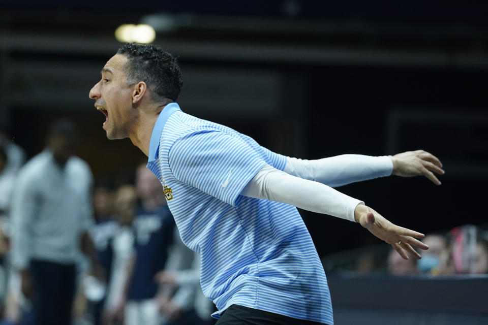 Marquette head coach Shaka Smart shouts during the second half of an NCAA college basketball game against Butler, Saturday, Feb. 12, 2022, in Indianapolis. (AP Photo/Darron Cummings)