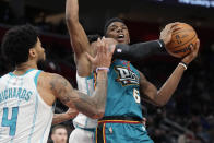 Detroit Pistons guard Hamidou Diallo (6) is defended by Charlotte Hornets center Nick Richards (4) during the first half of an NBA basketball game, Friday, Feb. 3, 2023, in Detroit. (AP Photo/Carlos Osorio)