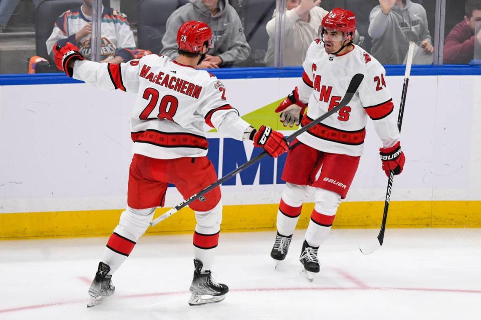 Carolina Hurricanes center Seth Jarvis (24) celebrates his goal against the New York Islanders with Carolina Hurricanes left wing Mackenzie MacEachern (28) during the third period in game four of the first round of the 2023 Stanley Cup Playoffs at UBS Arena.
