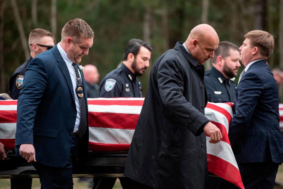 Law enforcement officers carry the caskets of Bay St. Louis police officers Sgt. Steven Robin and Branden Estorffe following their funeral at the Bay St. Louis Community Center in Bay St. Louis on Wednesday, Dec. 21, 2022. Robin and Estorffe were killed responding to a call at a Motel 6 on Dec. 14.