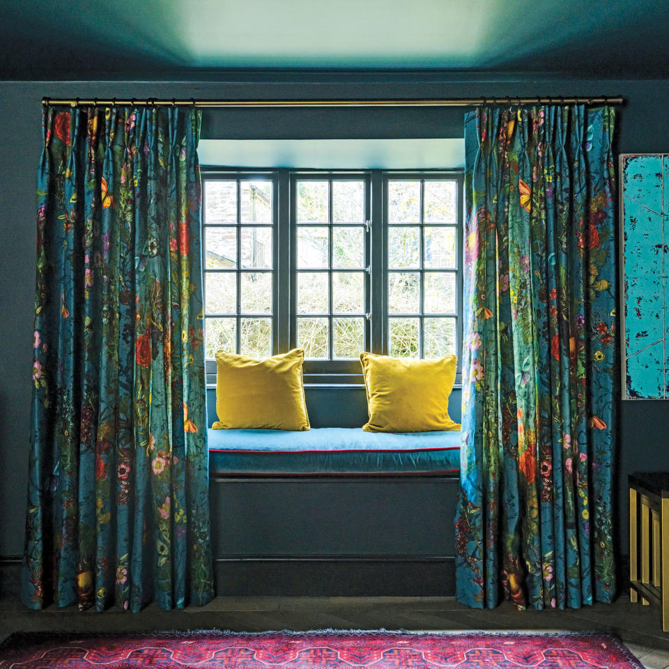 Teal room with velvet curtains