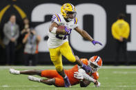 LSU running back Clyde Edwards-Helaire breaks away from Clemson cornerback Derion Kendrick during the second half of a NCAA College Football Playoff national championship game Monday, Jan. 13, 2020, in New Orleans. (AP Photo/Gerald Herbert)