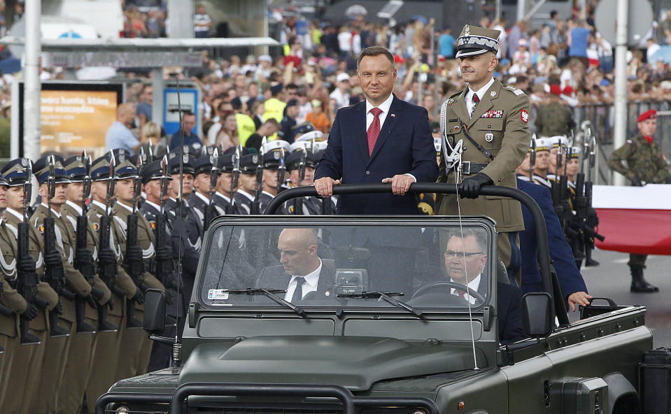 Poland's President Andrzej Duda attends the Polish National Army Day parade in Warsaw, Poland, Wednesday, Aug. 15, 2018.Poland's president voiced hope for a permanent U.S. military presence in his country as the country put on a large military parade on its Army Day .(AP Photo/Czarek Sokolowski)