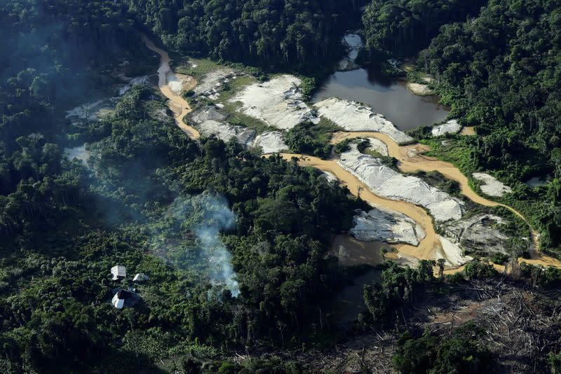 The Wider Image: Gold miners bring fresh wave of suffering to Brazil's Yanomami