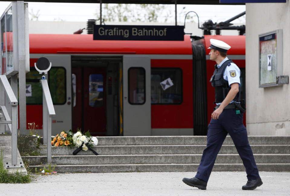 Police officers are pictured at the train station in Grafing, Germany, May 10, 2016. (REUTERS/Michaela Rehle)