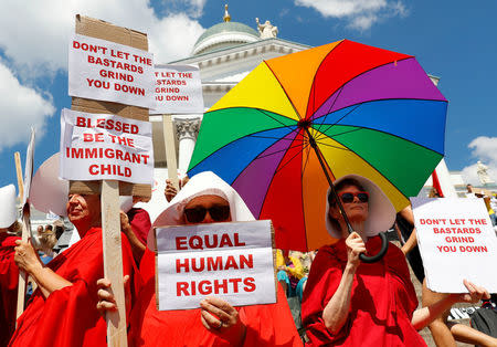 People attend 'Helsinki Calling' protest ahead of meeting between the U.S. President Donald Trump and Russian President Vladimir Putin in Helsinki, Finland July 15, 2018. REUTERS/Leonhard Foeger