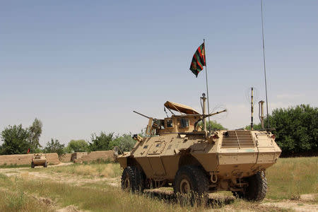 A military vehicle patrols in the Babaji area of Lashkar Gah Helmand province, Afghanistan May 8, 2016. REUTERS/Abdul Malik