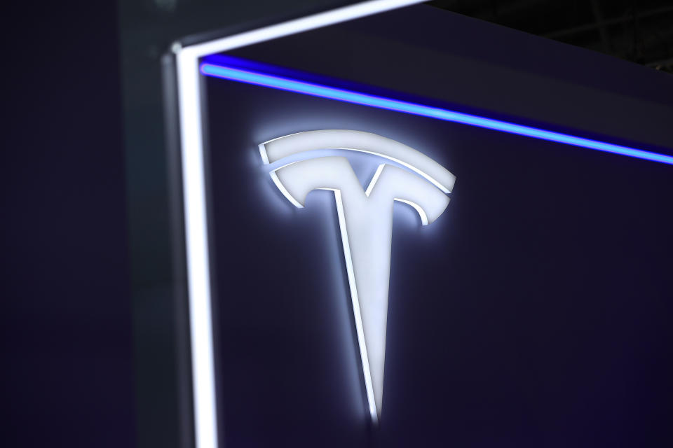 A logo on the Tesla Inc. stand on the opening day of the Munich Motor Show (IAA) in Munich, Germany, on Tuesday, Sept. 5, 2023. Photographer: Krisztian Bocsi/Bloomberg