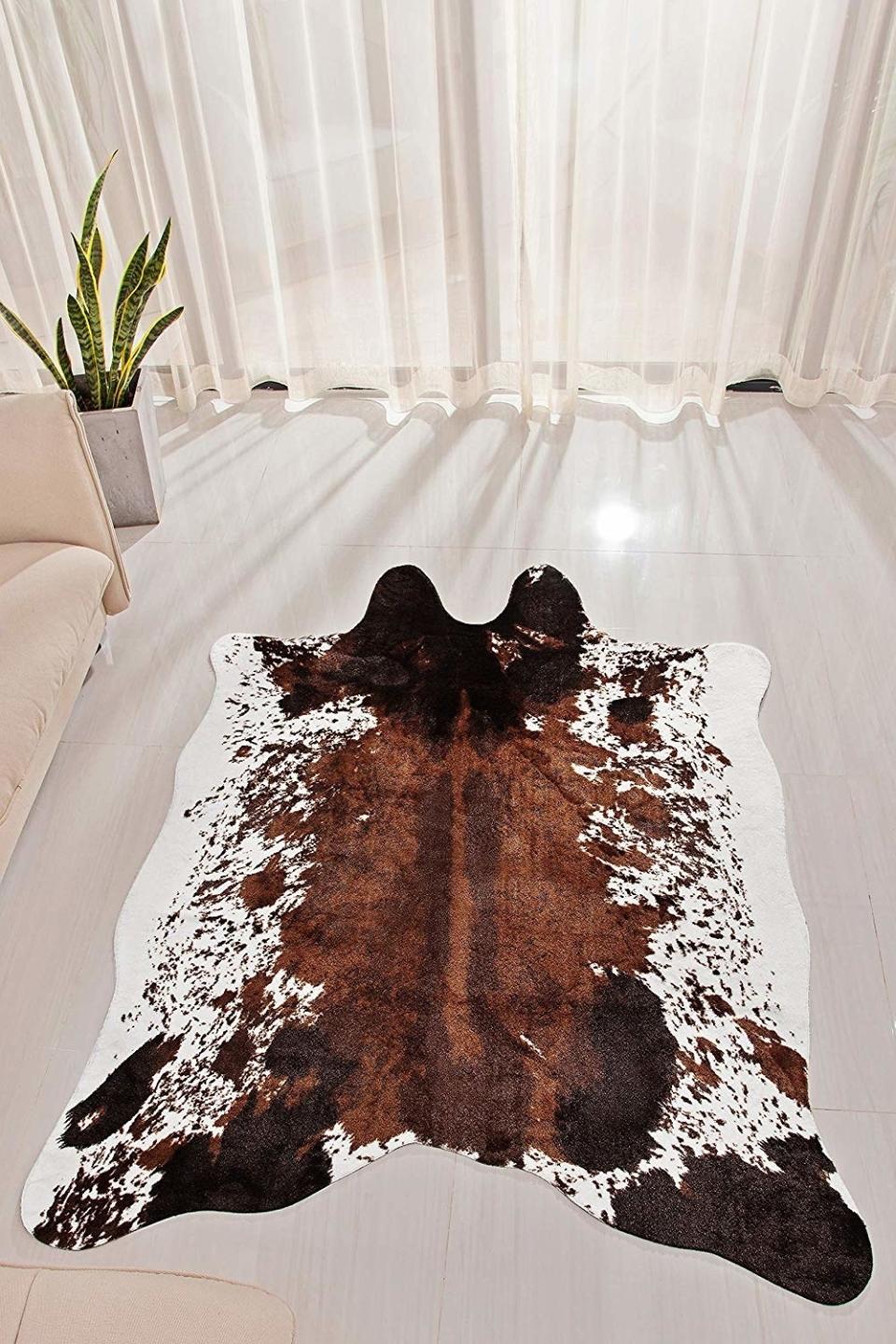 This rug is so darn good lookin', all your friends are gonna wanna <i>mooove</i> into your place.<br /><br /><strong>Promising review:</strong> "This rug is top-notch. Our new puppy had an accident on it and I was petrified it was ruined. I threw it in the washer on gentle with a mild detergent and then hug it up overnight to dry. It&rsquo;s like new but even softer!!! I LOOOVE this rug!!! I would buy it again and again!!!" &mdash; <a href="https://www.amazon.com/gp/customer-reviews/R383AAHMVHQ4VY?&amp;linkCode=ll2&amp;tag=huffpost-bfsyndication-20&amp;linkId=b4d993fe2a970ba87dd97ffacdaa527b&amp;language=en_US&amp;ref_=as_li_ss_tl" target="_blank" rel="nofollow noopener noreferrer" data-skimlinks-tracking="5854435" data-vars-affiliate="Amazon" data-vars-href="https://www.amazon.com/gp/customer-reviews/R383AAHMVHQ4VY?tag=bfmal-20&amp;ascsubtag=5854435%2C15%2C37%2Cmobile_web%2C0%2C0%2C16324239" data-vars-keywords="cleaning,fast fashion,skincare" data-vars-link-id="16324239" data-vars-price="" data-vars-product-id="20942661" data-vars-product-img="" data-vars-product-title="" data-vars-retailers="Amazon">Amazon Customer</a><br /><br /><strong>Get it from Amazon for <a href="https://www.amazon.com/NativeSkins-Faux-Cowhide-Rug-Large/dp/B07GYBWWC2?&amp;linkCode=ll1&amp;tag=huffpost-bfsyndication-20&amp;linkId=1723442dd6c01572cfa39945c2e3993f&amp;language=en_US&amp;ref_=as_li_ss_tl" target="_blank" rel="nofollow noopener noreferrer" data-skimlinks-tracking="5854435" data-vars-affiliate="Amazon" data-vars-asin="B07GYBWWC2" data-vars-href="https://www.amazon.com/dp/B07GYBWWC2?tag=bfmal-20&amp;ascsubtag=5854435%2C15%2C37%2Cmobile_web%2C0%2C0%2C16323367" data-vars-keywords="cleaning,fast fashion,skincare" data-vars-link-id="16323367" data-vars-price="" data-vars-product-id="15942563" data-vars-product-img="https://m.media-amazon.com/images/I/41A8lAkT0NL.jpg" data-vars-product-title="NativeSkins Faux Cowhide Rug Large (4.6ft x 6.6ft) - Cow Print Area Rug for a Western Boho Decor - Synthetic, Cruelty-Free Animal Hide Carpet with No-Slip Backing" data-vars-retailers="Amazon">$84.99</a>.</strong>