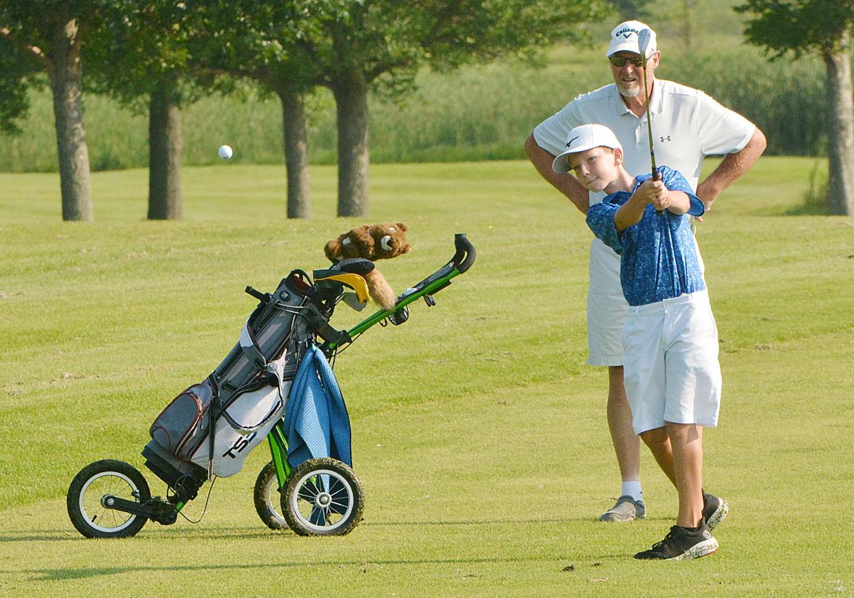 Parker Serr of Aberdeen (10-11 boys) hits to the green on No. 4 Blue during the South Dakota Golf Association Junior Tour stop on Tuesday, July 9, 2024 at Cattail Crossing Golf Course in Watertown.