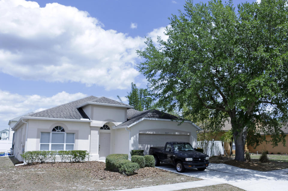 The home of Gustavo 'Taby' Flacon sits vacant in a quiet suburb in Kissimmee, Fla., on Thursday, April 13, 2017, the day after his arrest for drug smuggling. Falcon was arrested and charged with smuggling tons of cocaine into the United States in the 1980's. (AP Photo/John Raoux)