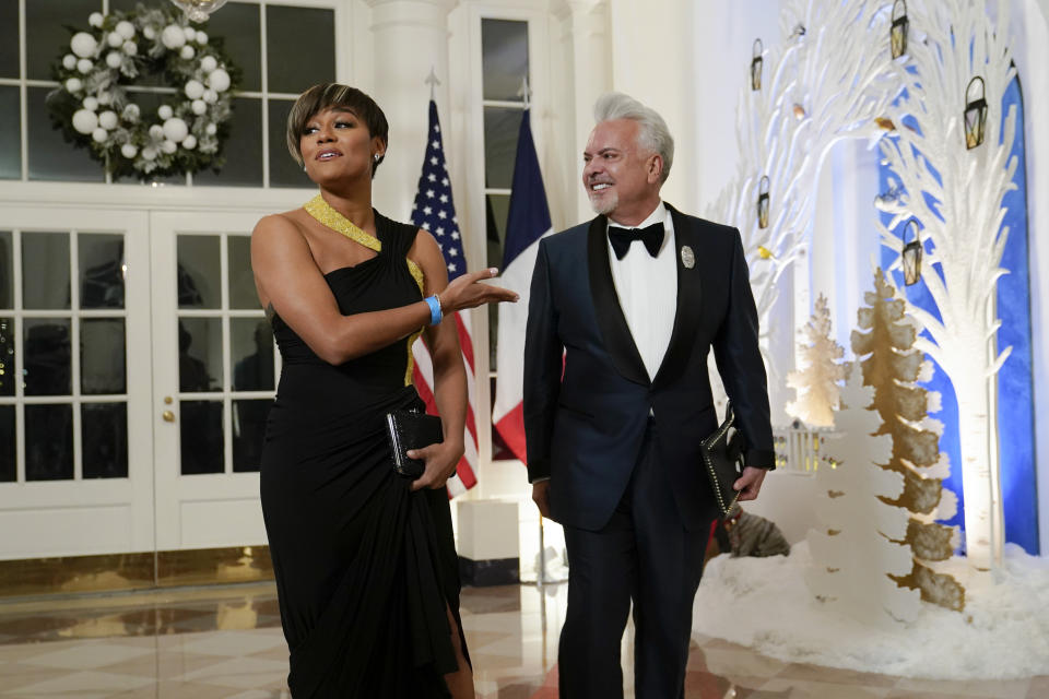 Actress Ariana DeBose and Henry Munoz III arrive for the State Dinner with President Joe Biden and French President Emmanuel Macron at the White House in Washington, Thursday, Dec. 1, 2022. (AP Photo/Susan Walsh)