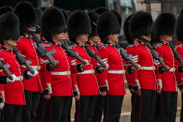 LONDON, ENGLAND - SEPTEMBER 19: Royal guards react ahead of the State Funeral of Queen Elizabeth II at Westminster Abbey on September 19, 2022 in London, England. Elizabeth Alexandra Mary Windsor was born in Bruton Street, Mayfair, London on 21 April 1926. She married Prince Philip in 1947 and ascended the throne of the United Kingdom and Commonwealth on 6 February 1952 after the death of her Father, King George VI. Queen Elizabeth II died at Balmoral Castle in Scotland on September 8, 2022, and is succeeded by her eldest son, King Charles III. (Photo by Emilio Morenatti - WPA Pool/Getty Images)