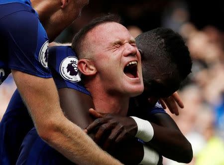 Football Soccer - Premier League - Everton vs Stoke City - Liverpool, Britain - August 12, 2017 Everton's Wayne Rooney celebrates scoring their first goal with team mates Action Images via Reuters/Lee Smith