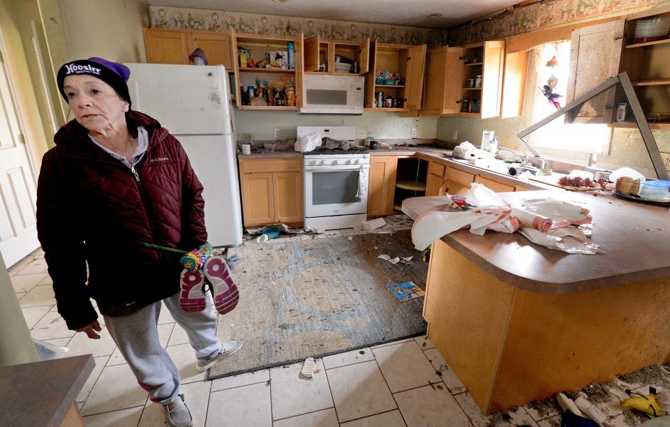 Brenda Books stands in her damaged kitchen Saturday, April 1, 2023. She and her 96-year-old mother rode out the tornado in the bathroom of the house on West Outer Road in Sherman. The damage to the structure of house makes it uninhabitable.