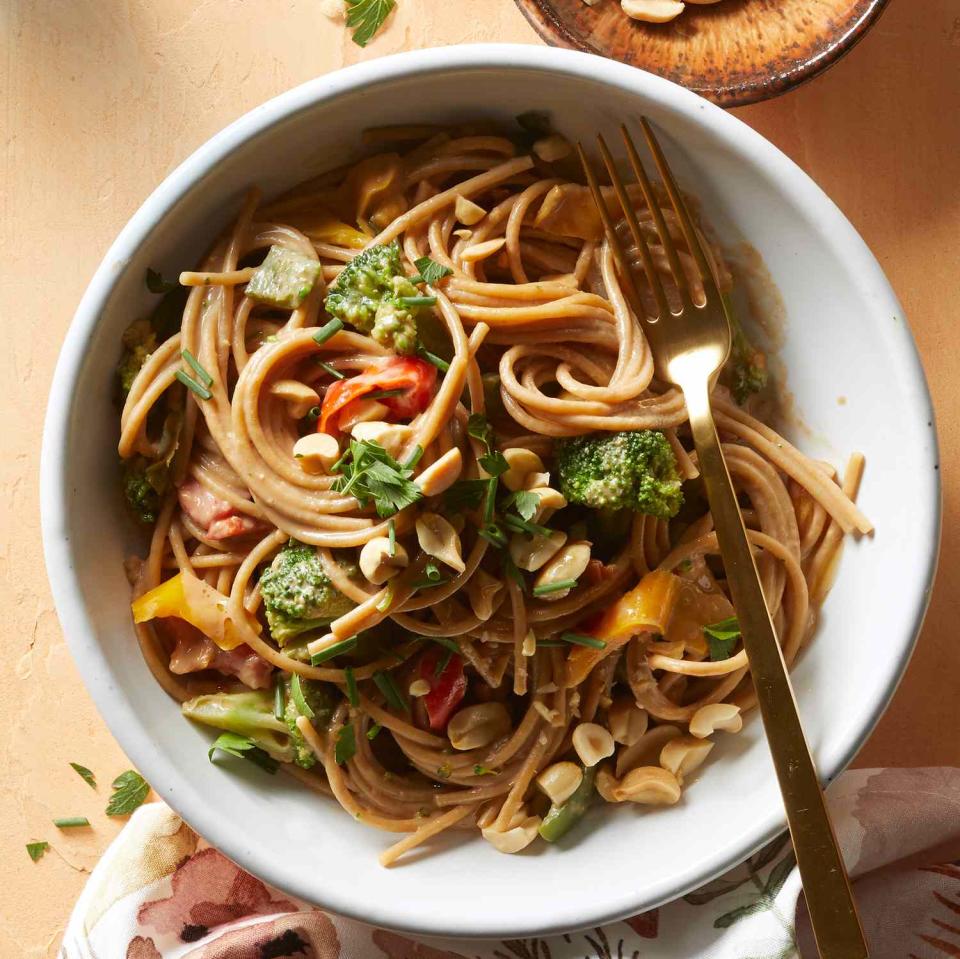 <p>Choose your own adventure with these noodles! They're delicious with peanut butter and tahini alike. Plus, you can use whatever frozen vegetables you have on hand and finish the dish off with any herbs still thriving in your garden or hanging out in your crisper. <a href="https://www.eatingwell.com/recipe/7911845/pantry-peanut-noodles/" rel="nofollow noopener" target="_blank" data-ylk="slk:View Recipe;elm:context_link;itc:0;sec:content-canvas" class="link ">View Recipe</a></p>
