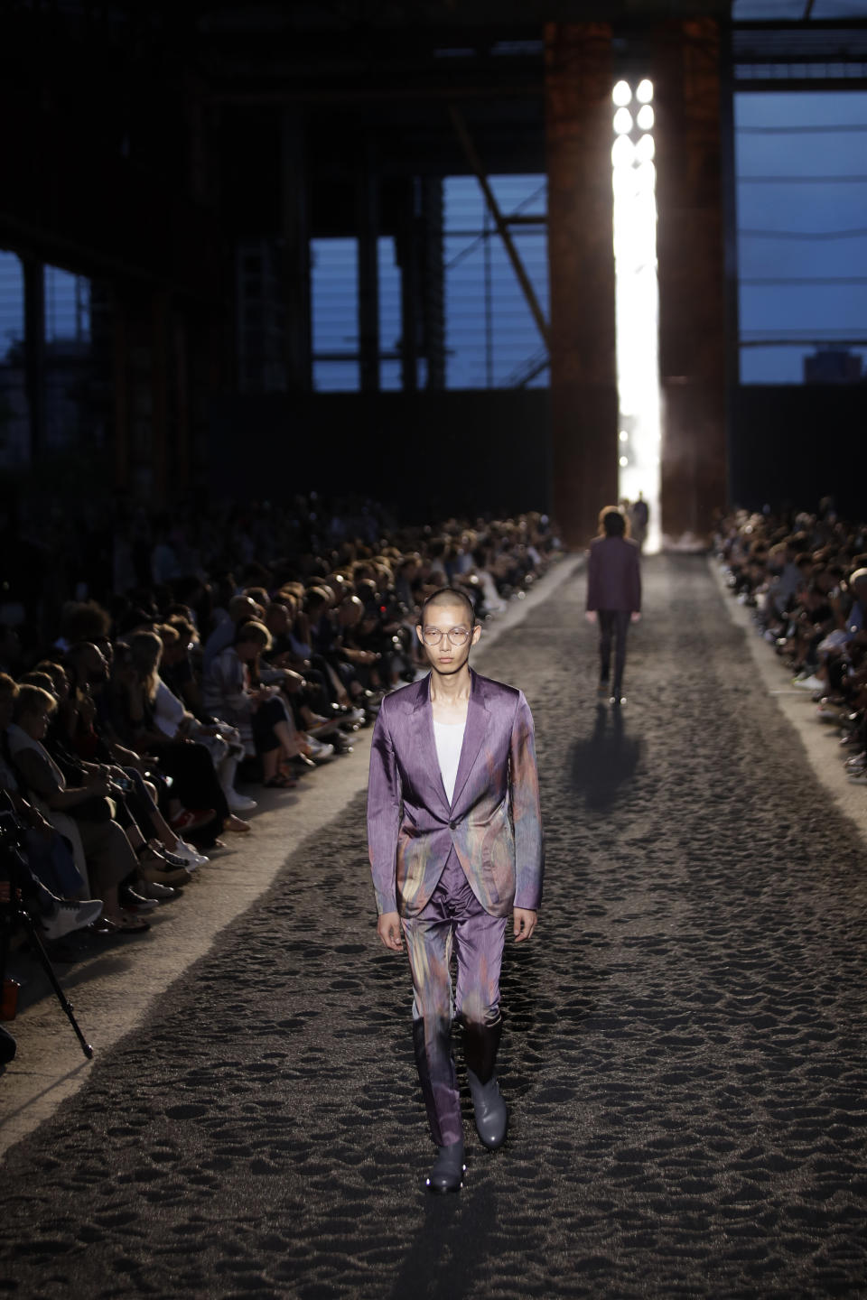 A model wears a creation as part of the Ermenegildo Zegna men's Spring-Summer 2020 collection, unveiled during the fashion week, in Milan, Italy, Friday, June 14, 2019. (AP Photo/Luca Bruno)