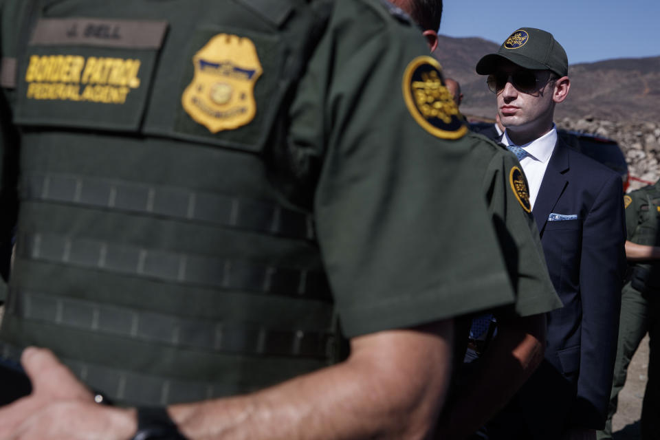 White House senior adviser Stephen Miller looks on as President Donald Trump tours a section of the southern border wall, Wednesday, Sept. 18, 2019, in Otay Mesa, Calif. (Photo: Evan Vucci/AP)   