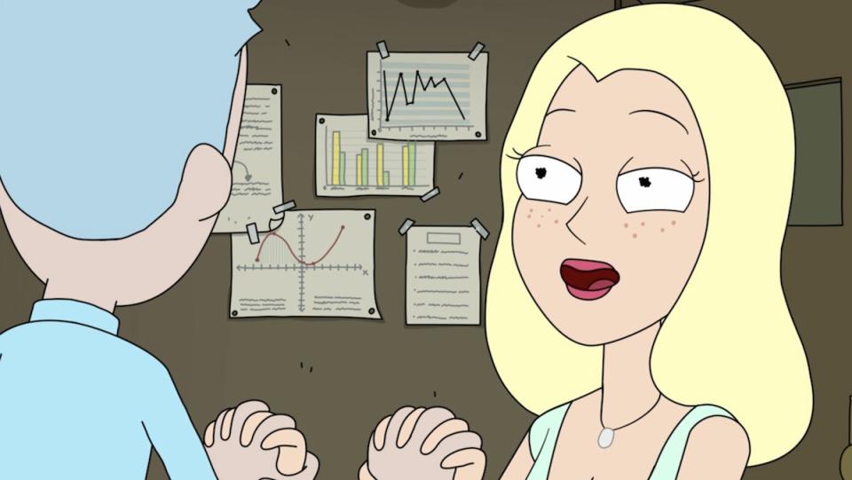 A blonde woman holds Rick's hands in front of a wall with graphs on Rick and Morty