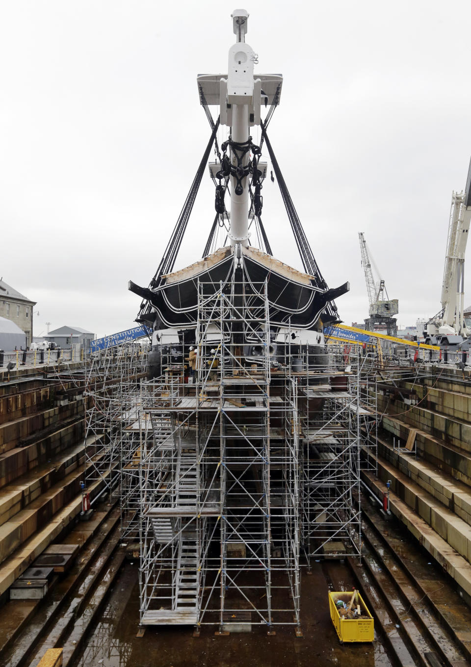 Restoration work continues on the USS Constitution in dry dock, Wednesday, April 5, 2017, at the Charlestown Navy Yard in Boston. The ship enters dry dock for below-the-waterline repairs every 20 years. The world's oldest commissioned warship afloat is scheduled to return to the waters in late July. (AP Photo/Elise Amendola)