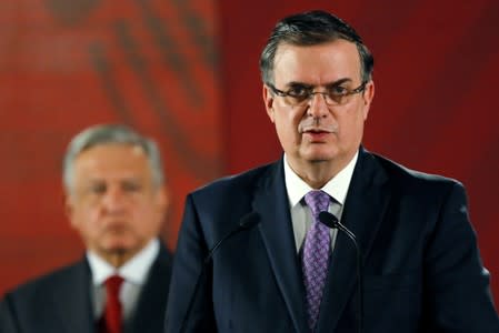 Mexican Foreign Minister Marcelo Ebrard speaks during a news conference as Mexican president Andres Manuel Lopez Obrador looks on, at National Palace in Mexico City
